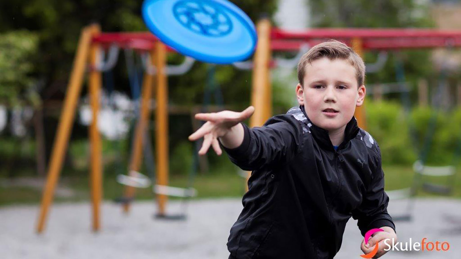 Boy throwing a frisbee