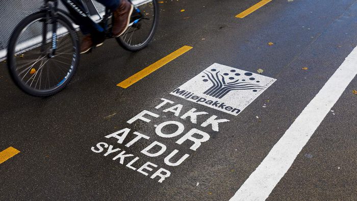 "Thank for cycling" printed on a bicycle path